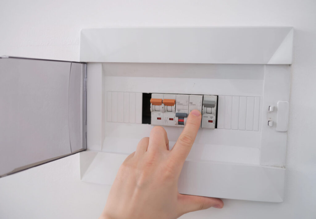 Circuit breaker panel with a tripped breaker