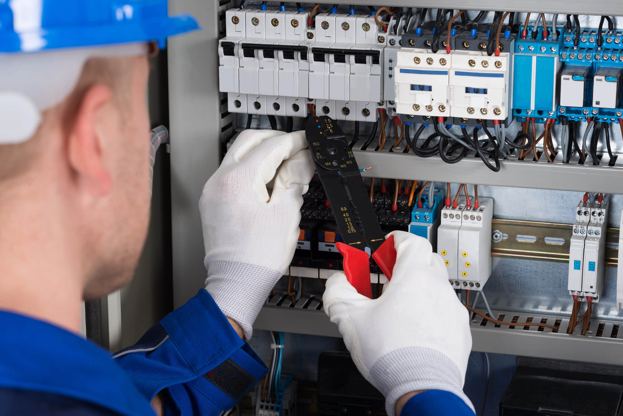 Electrician Repairing Fusebox