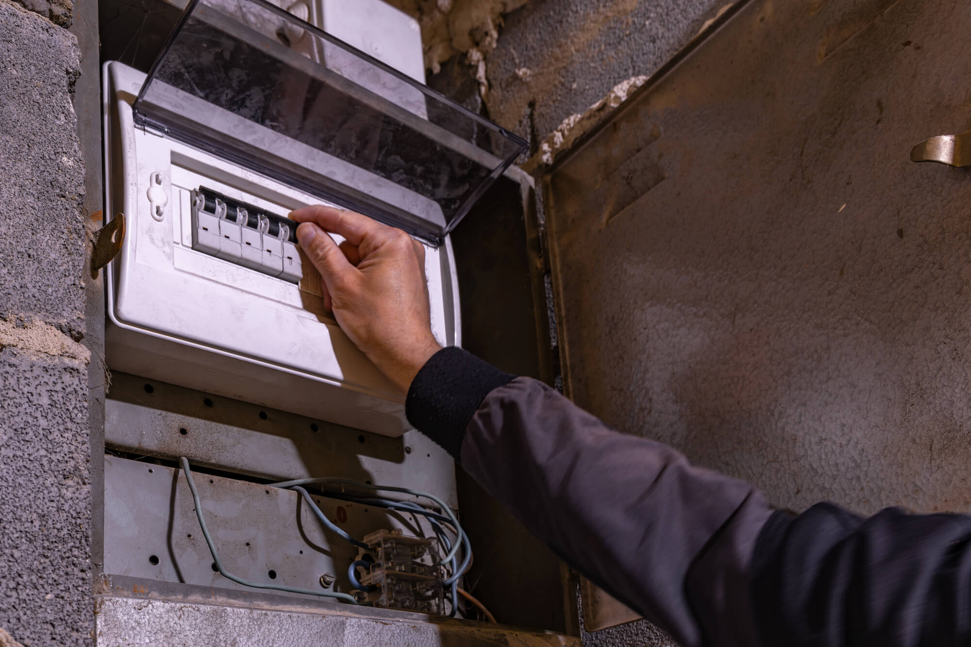 Old electrical fuse box on the wall in the basement