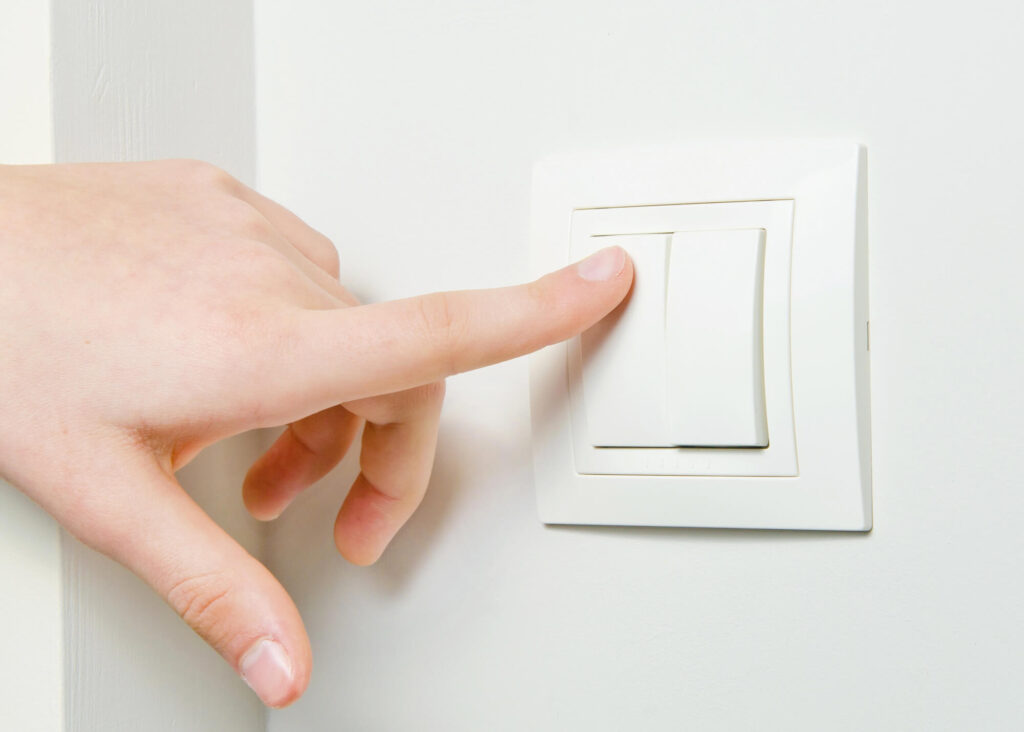 Electrical light switch mounted on a wall